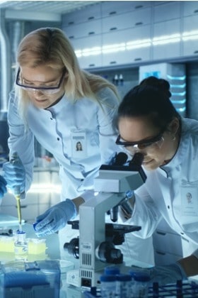 close-up-of-medical-research-scientists-looking-through-microscope