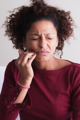 woman-with-toothache-touching-cheek