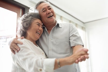happy-smiling-asian-senior-couple-dancing