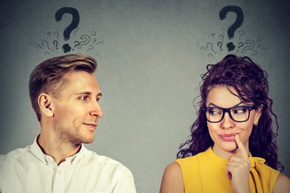 man-and-woman-with-question-mark-looking-at-each-other-with-interest