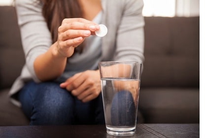 woman-about-to-take-antacid-for-stomach-gut-pain