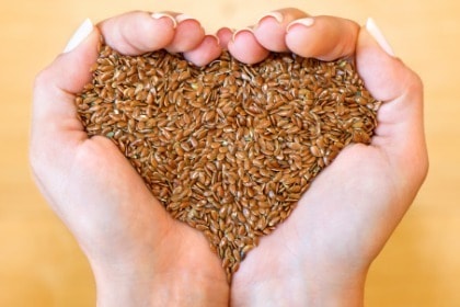 hands-holding-flax-seeds-in-heart-shape
