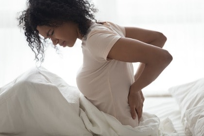 young-woman-hands-on-back-fibromyalgia-backpain