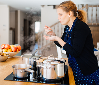 Woman Cooks Using Bone Broth Recipe by Organixx