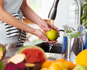 Woman Washing Fruits and Vegetables