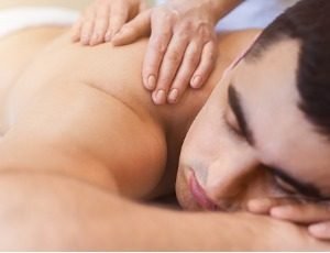 man receiving back massage